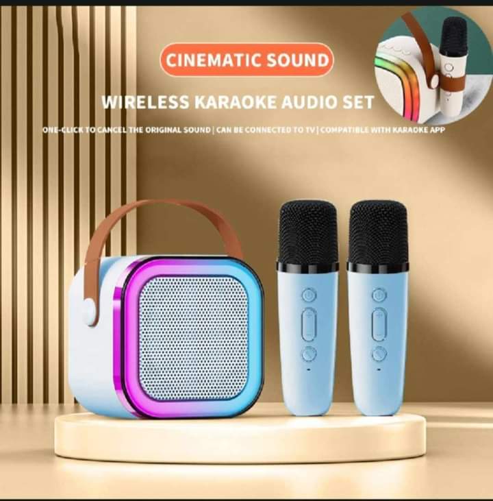 MINI K12 speaker comes with two karaoke microphones